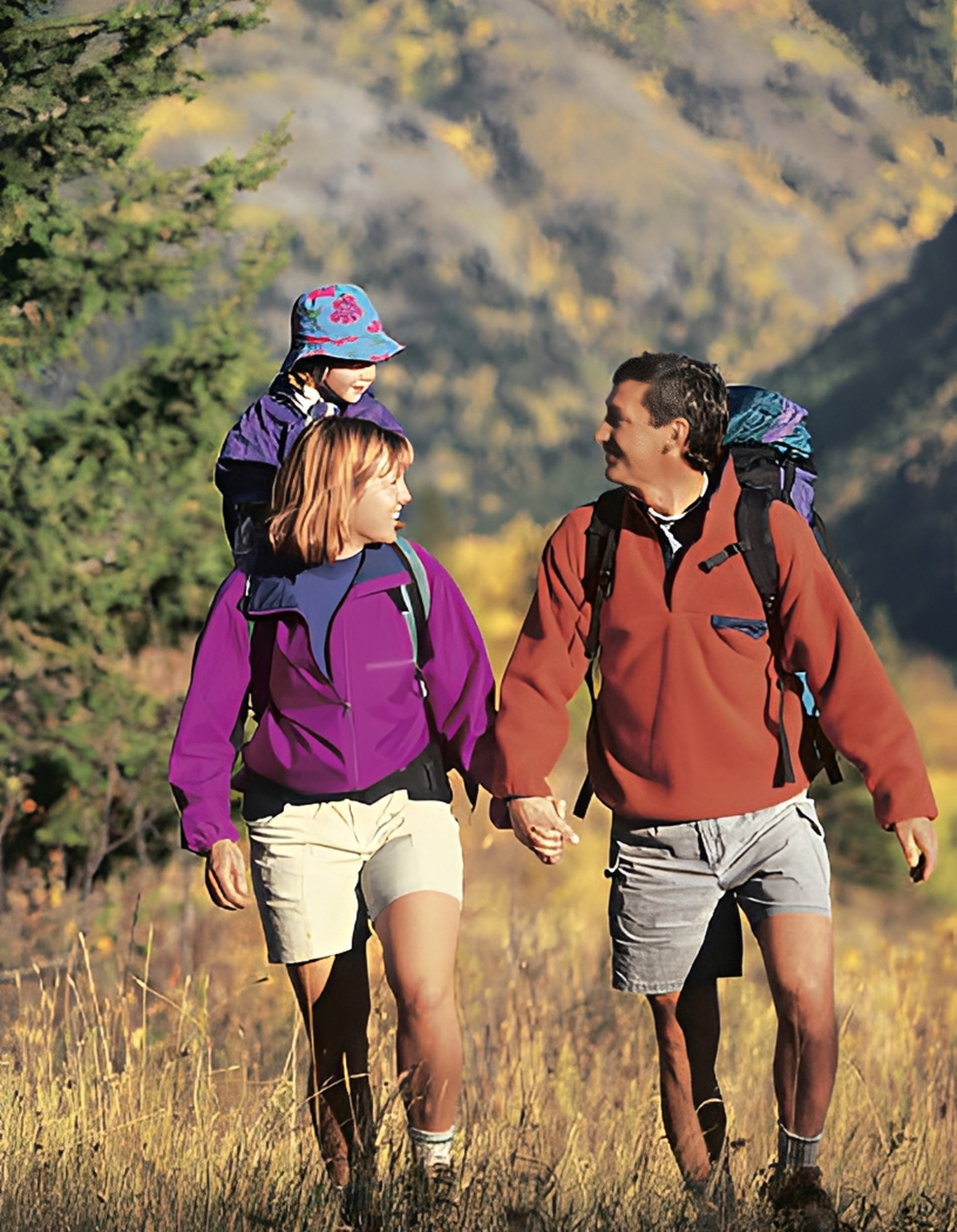 Family hiking in a scenic mountain landscape.